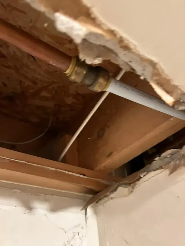 Supply pipe exposed in an opened ceiling in La Mesa